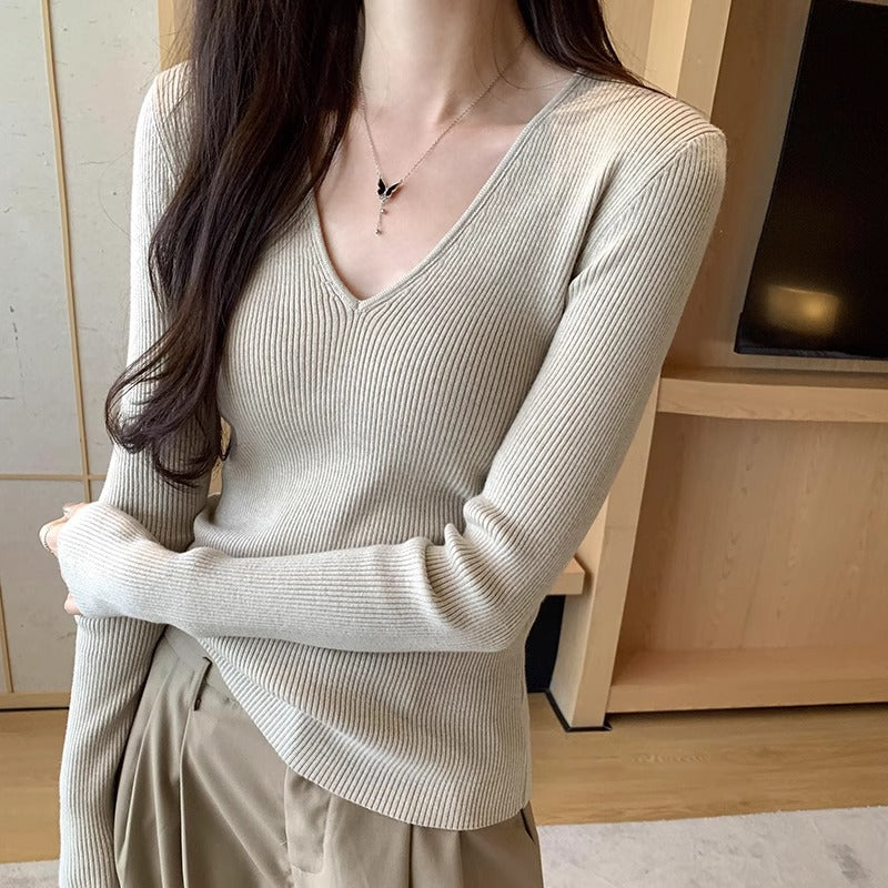 Slimming Knit Top With A Distinctive V-neck And Long Sleeves